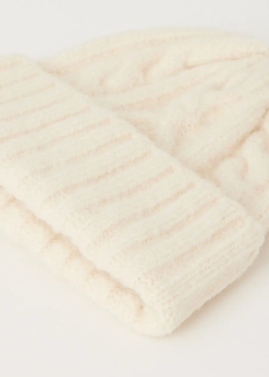 The Sting Muts met kabelpatroon<DAMES Mutsen