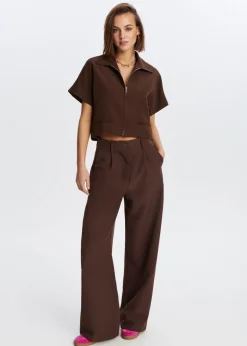 The Sting Top met rits<DAMES Tops