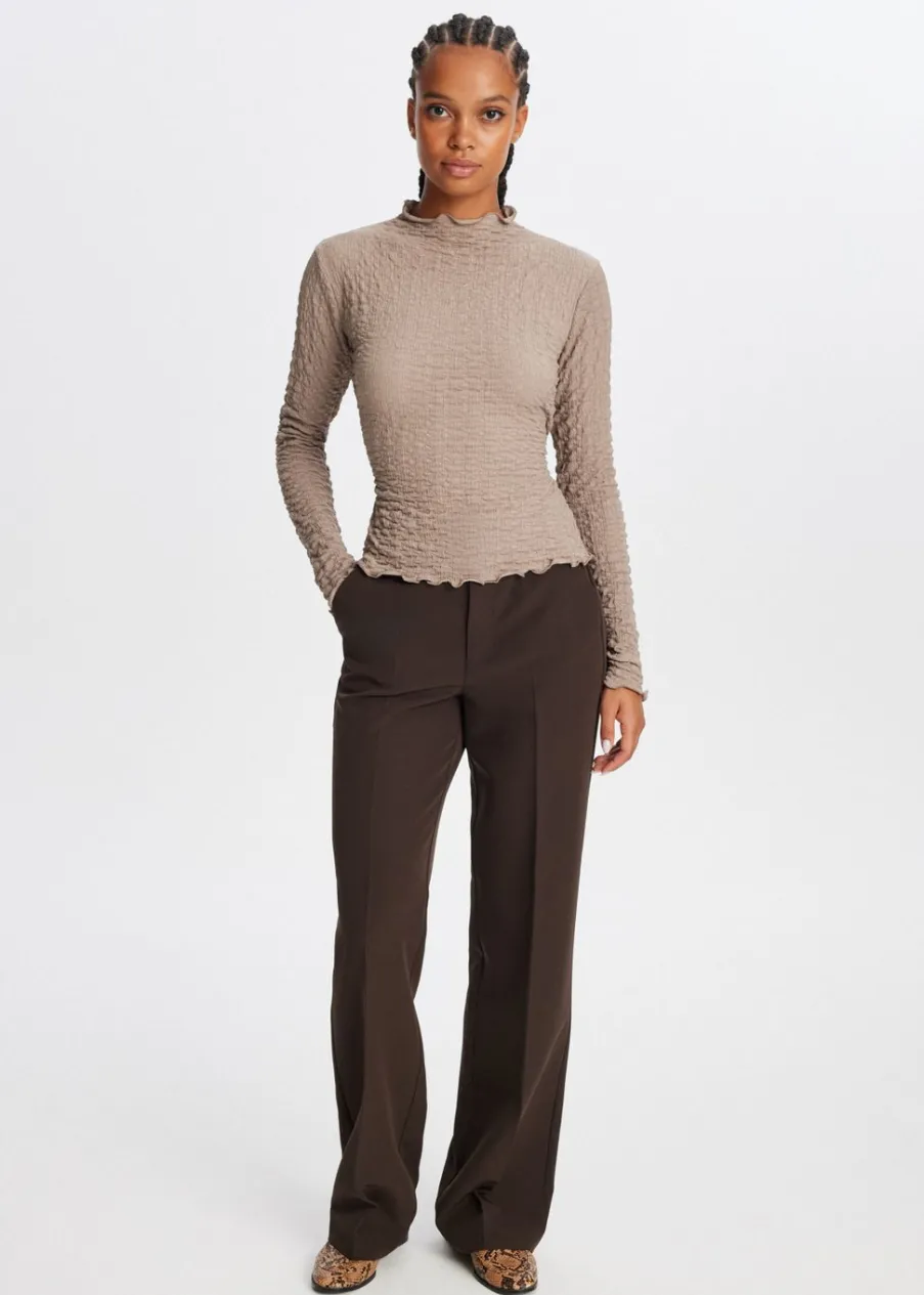 The Sting Top met strikdetail<DAMES Tops